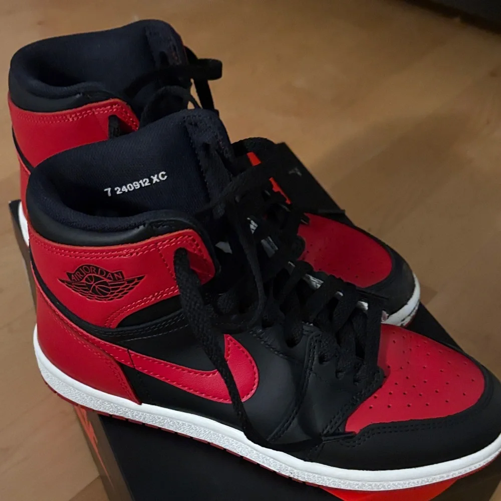 Nike Air Jordan 1 High in Black and Red